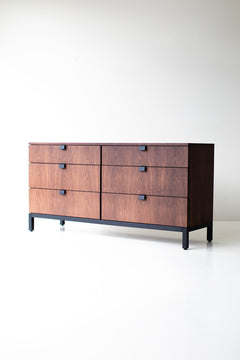 Modern walnut chest styled with decor on top