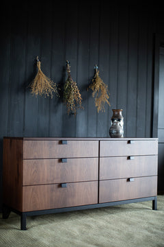 Full view of the Milo Baughman six drawer chest against a neutral backdrop