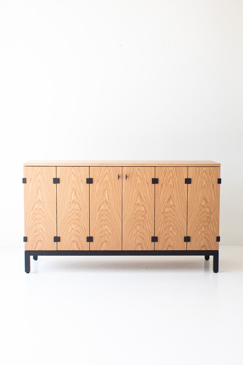 Full view of the maple credenza against a neutral wall in a styled interior