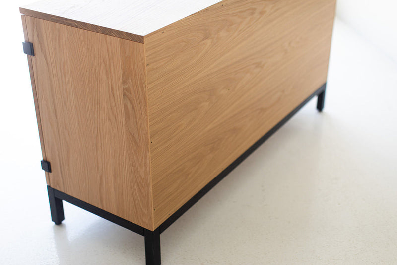 Open credenza doors revealing the interior storage and shelving