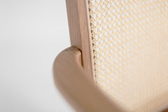 Front view of the highback dining arm chair showing its tall arched oak frame