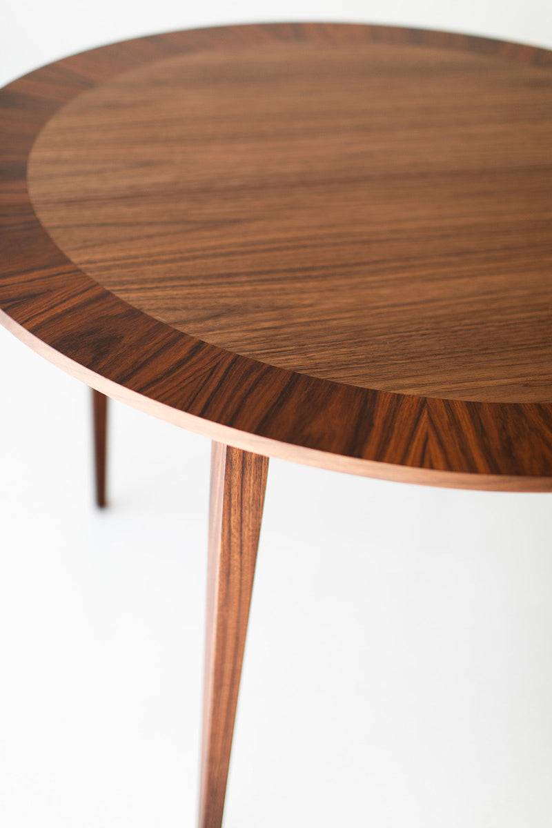 Side profile of the round dining table showing its base