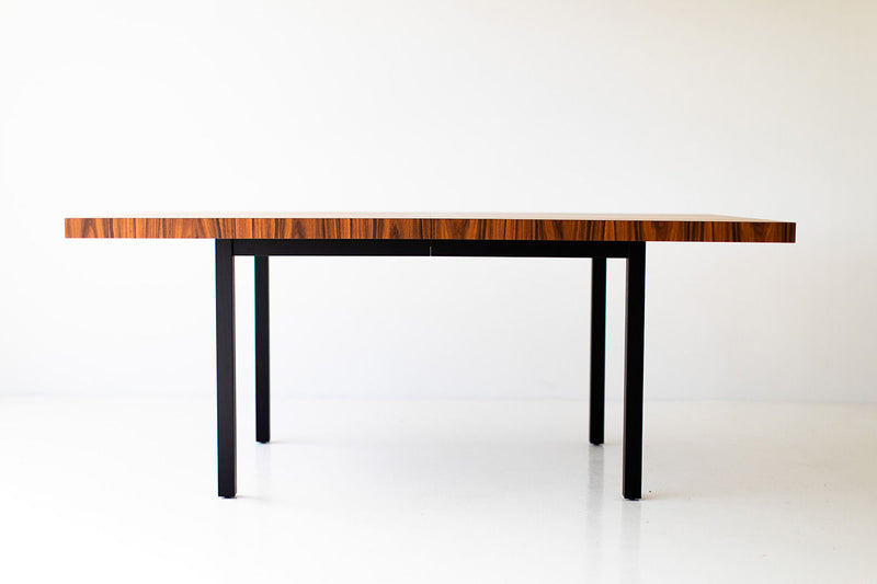 Angled view of the dining table highlighting the striped wood pattern