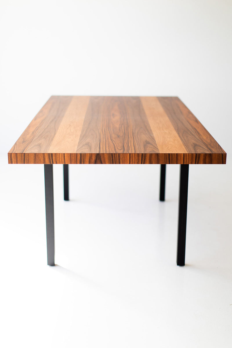 Modern luxury striped top walnut dining table styled in a dining room