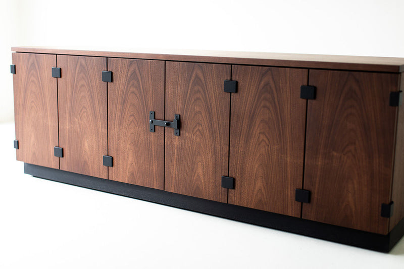 Close-up of the walnut veneer grain on the sideboard doors