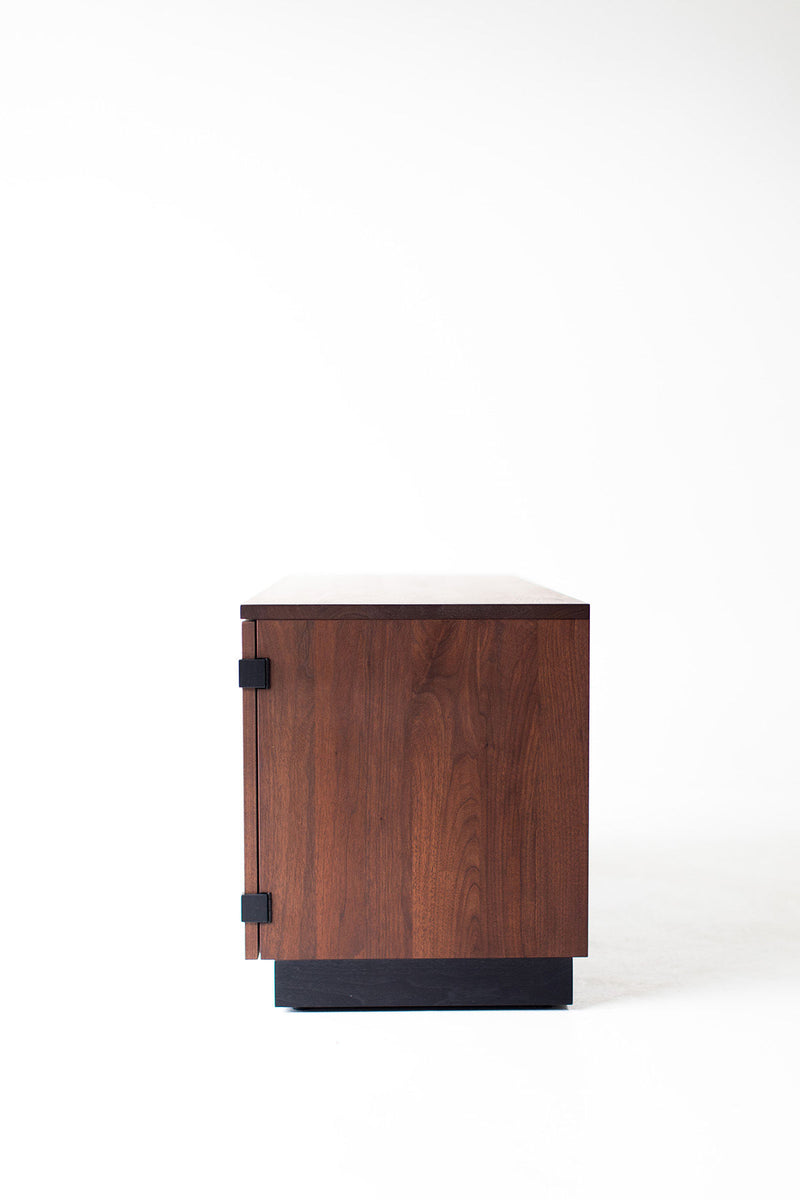 Angled view of the sideboard highlighting its walnut frame
