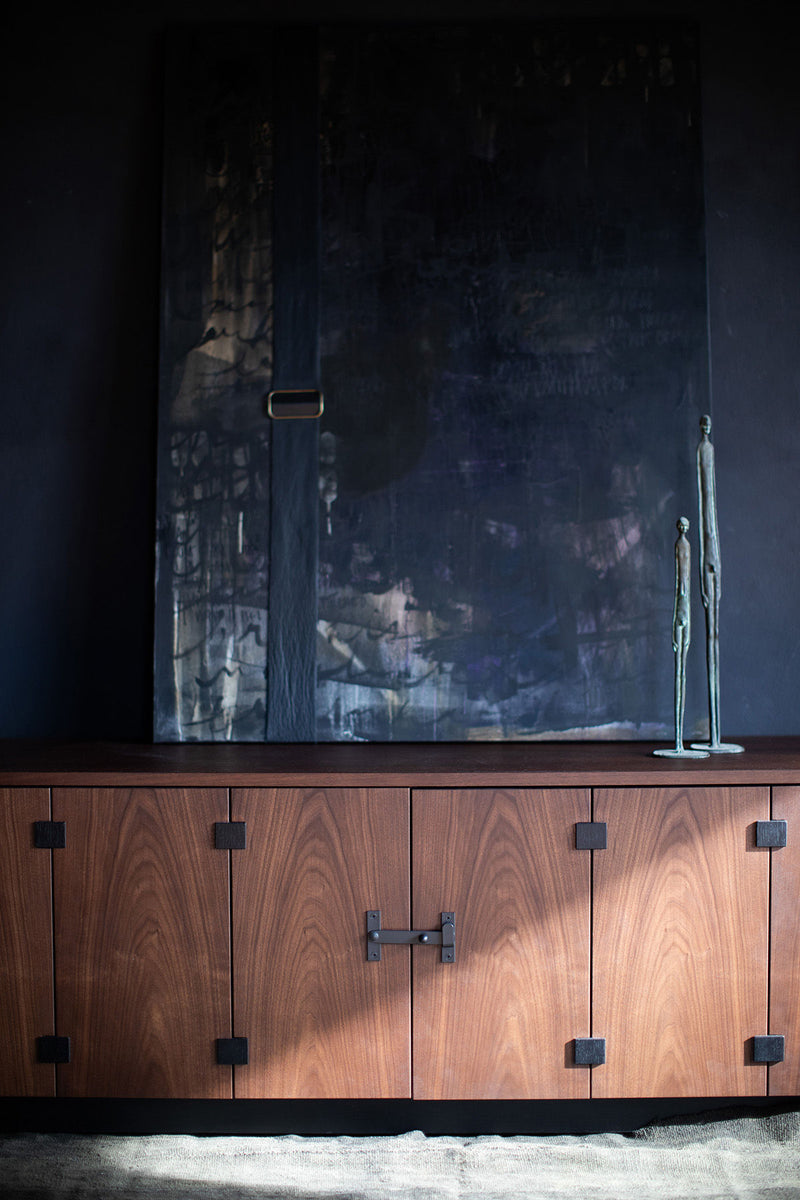 Detail of a door pull on the walnut sideboard
