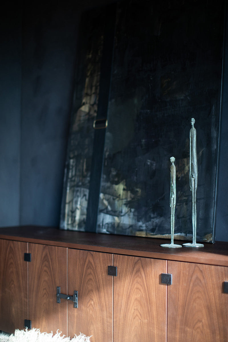 Full view of the walnut sideboard against a neutral backdrop