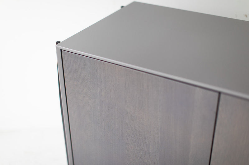 Close-up of the grey hand-lacquered maple door front on the modern luxury Cambre credenza