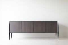 Modern luxury grey Cambre credenza styled in a bright modern interior