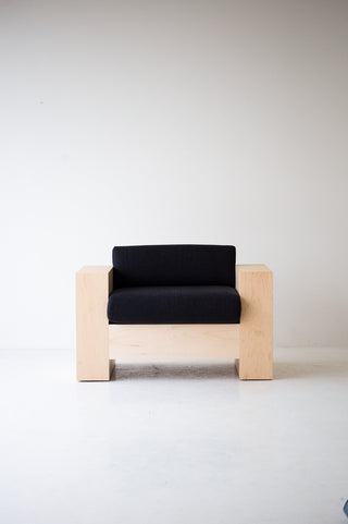 Detail of the solid maple veneer wood grain on the modern Mondo lounge chair