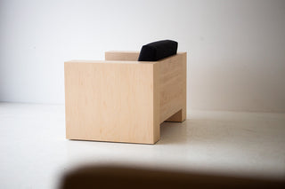 Close-up of the natural commercial-grade finish on the modern maple Mondo lounge chair