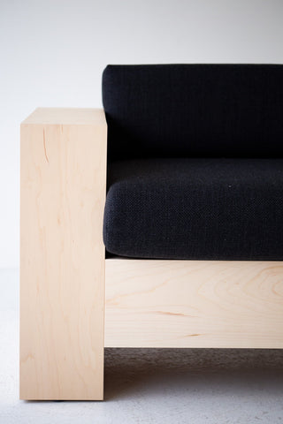 Mondo maple lounge chair in black thick weave fabric paired with the matching Mondo sofa