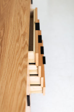 Modern luxury oak credenza styled along a home office wall