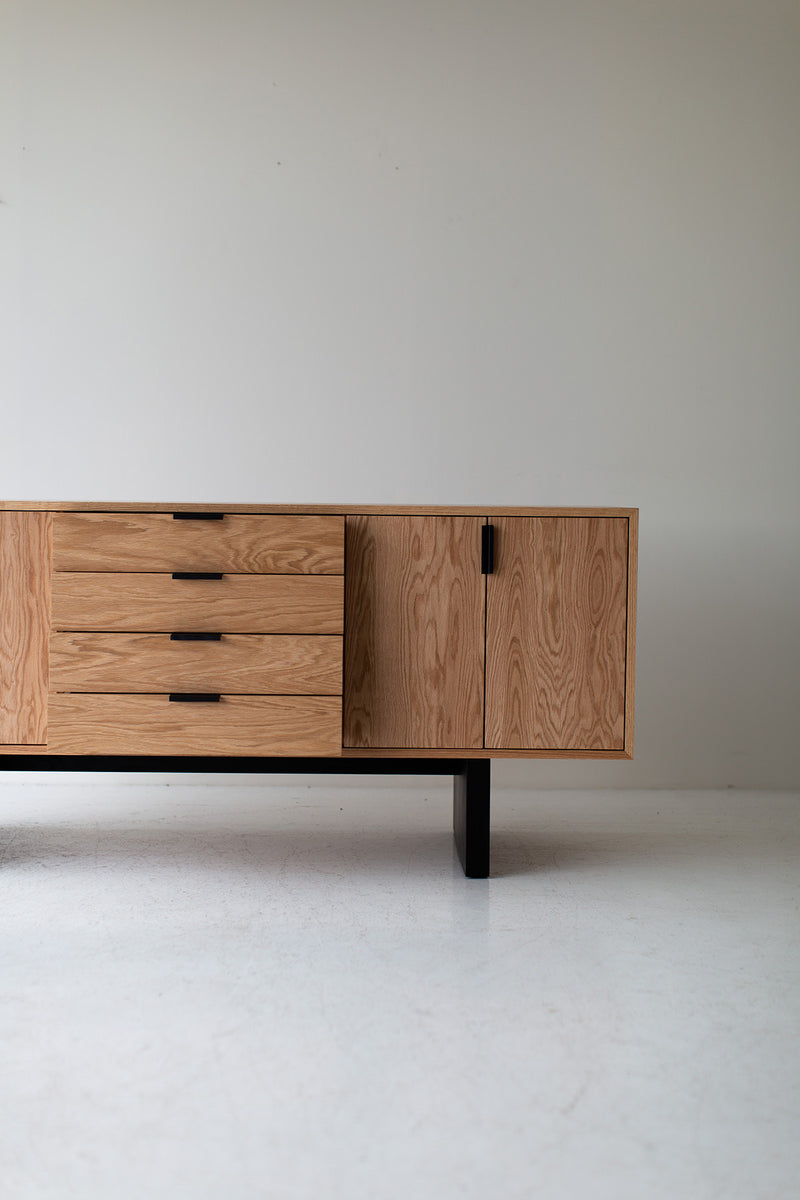 The credenza styled with objects and art above it