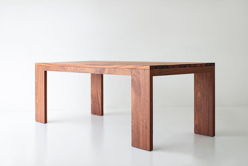 Side profile of an outdoor dining table highlighting its slatted tabletop