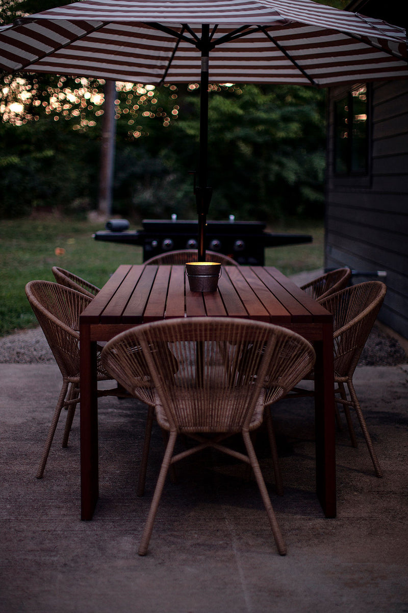 Close-up of the hand-rubbed teak oil finish on a mahogany dining table