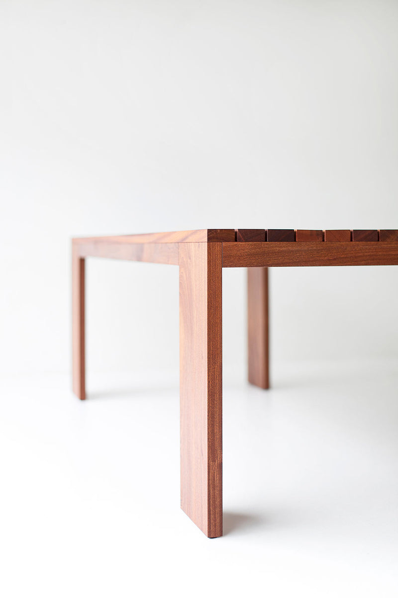 Overhead view of a slatted top dining table showing its full surface