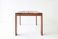 Full view of a Chile slatted top dining table against a white backdrop