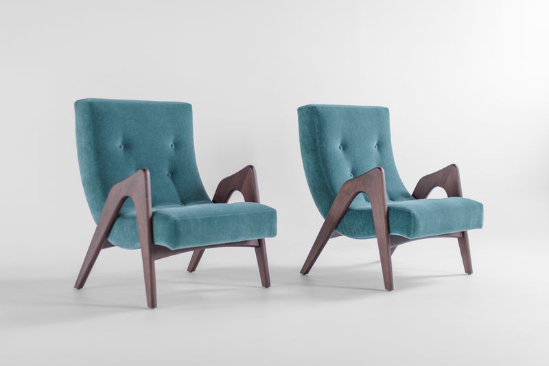 Modern luxury Scoop lounge chair in black leather with a hand-shaped walnut frame by Craft Associates®, front view