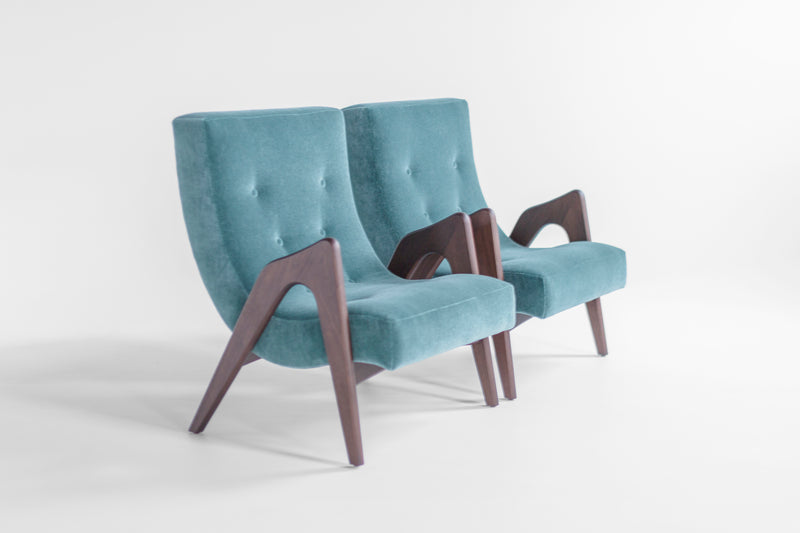 Detail of the hand-finished walnut grain and joinery on the modern luxury Scoop chair frame