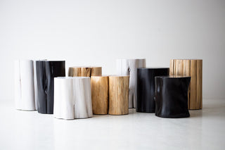 Black stump side table styled as a modern nightstand