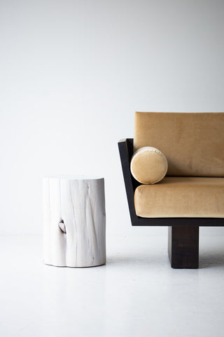 Whitewash red cedar stump side table shown at an angle