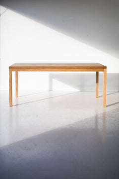Modern luxury white oak dining table styled with place settings