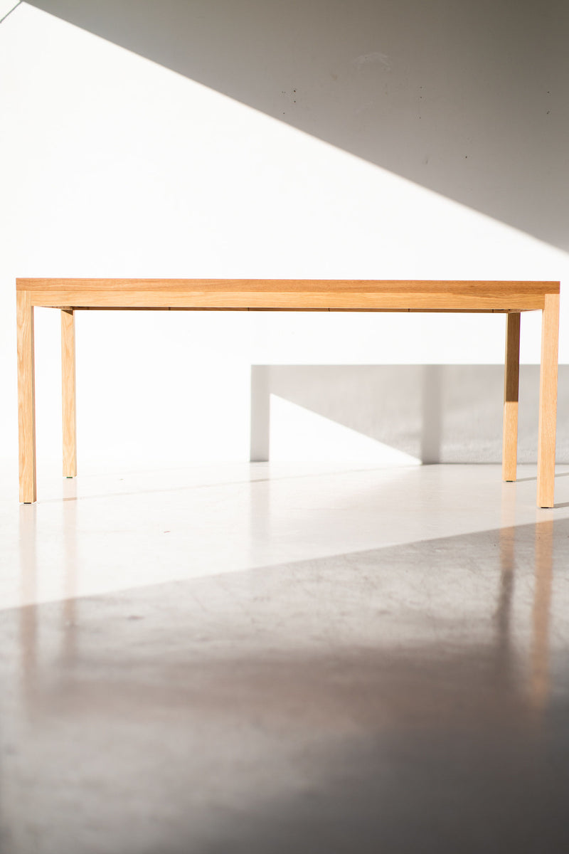 Modern luxury white oak dining table viewed from above