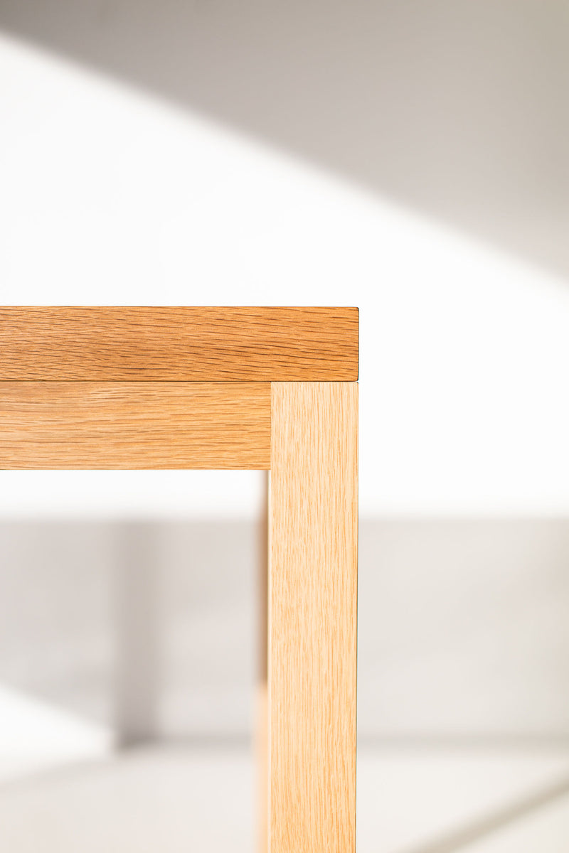 Angled detail of the handcrafted white oak tabletop joinery