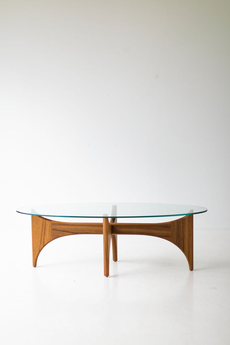 Craft Associates oval teak coffee table shown at an angle