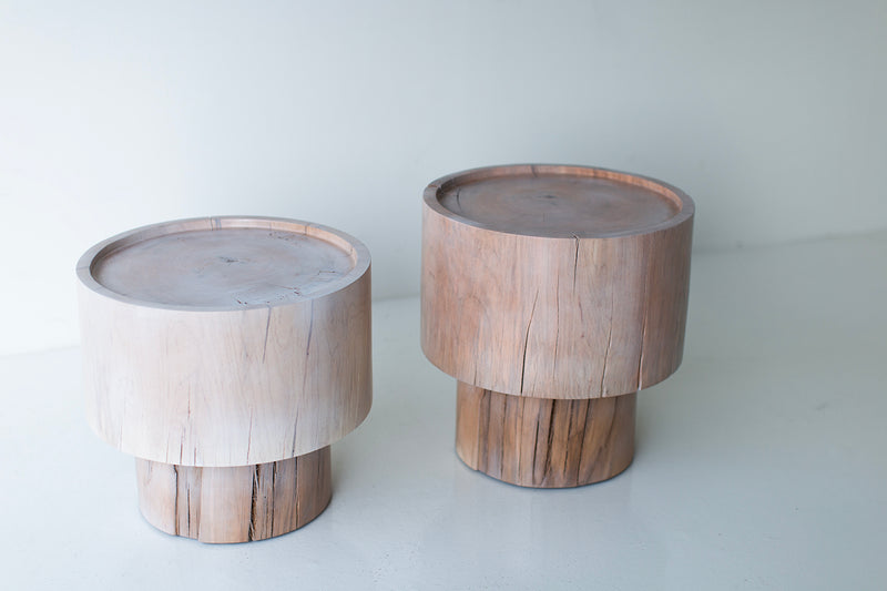 The Breeze side table styled beside a lounge chair in a modern living room