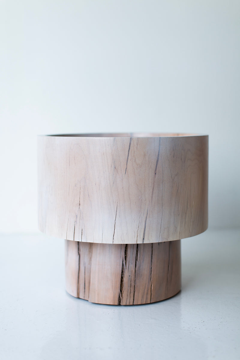 Angled view of The Breeze side table highlighting its sculptural form