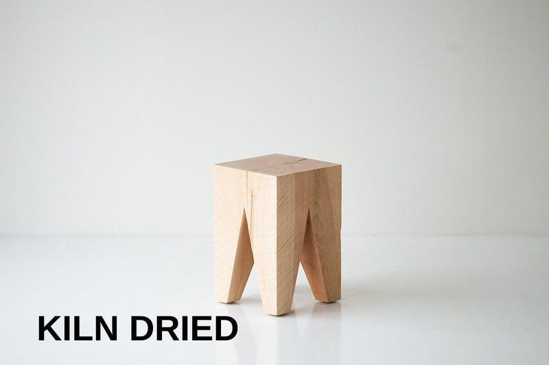Organic modern sculpted maple stump stool with angled corners, front view
