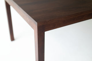 Close-up of the walnut tabletop grain and matte finish