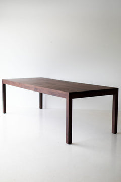 Angled view of the walnut dining table showcasing its proportions