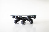 Modern luxury black cast bronze coffee table with glass top, front view