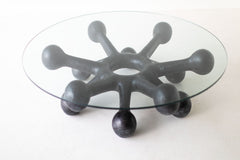 Modern luxury black bronze coffee table styled in a living room