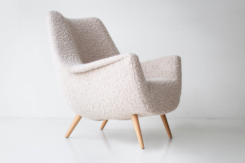 Angled view of a pair of Danish lounge chairs from the Holiday series