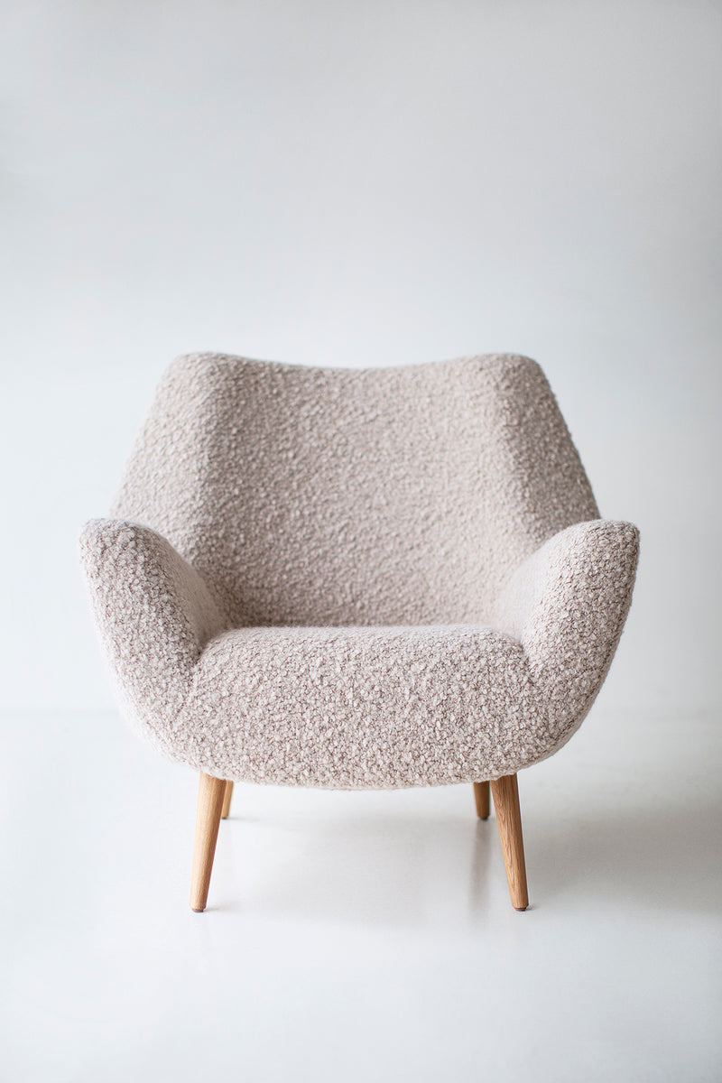 Overhead view of a bouclé lounge chair seat cushion