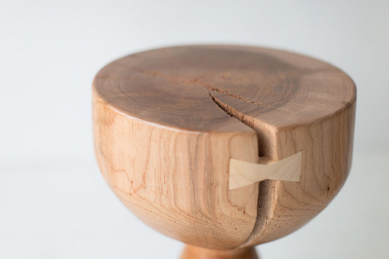 Modern luxury solid maple stool styled in a dining room