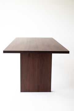 Modern luxury Toko walnut dining table styled in a dining room