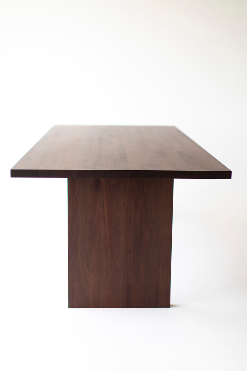 Modern luxury Toko walnut dining table styled in a dining room