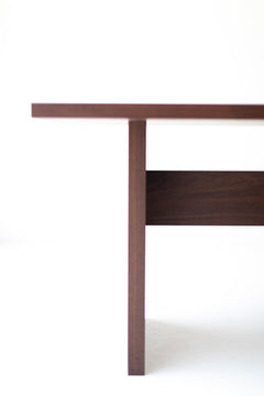 Toko Table shown with chairs around it