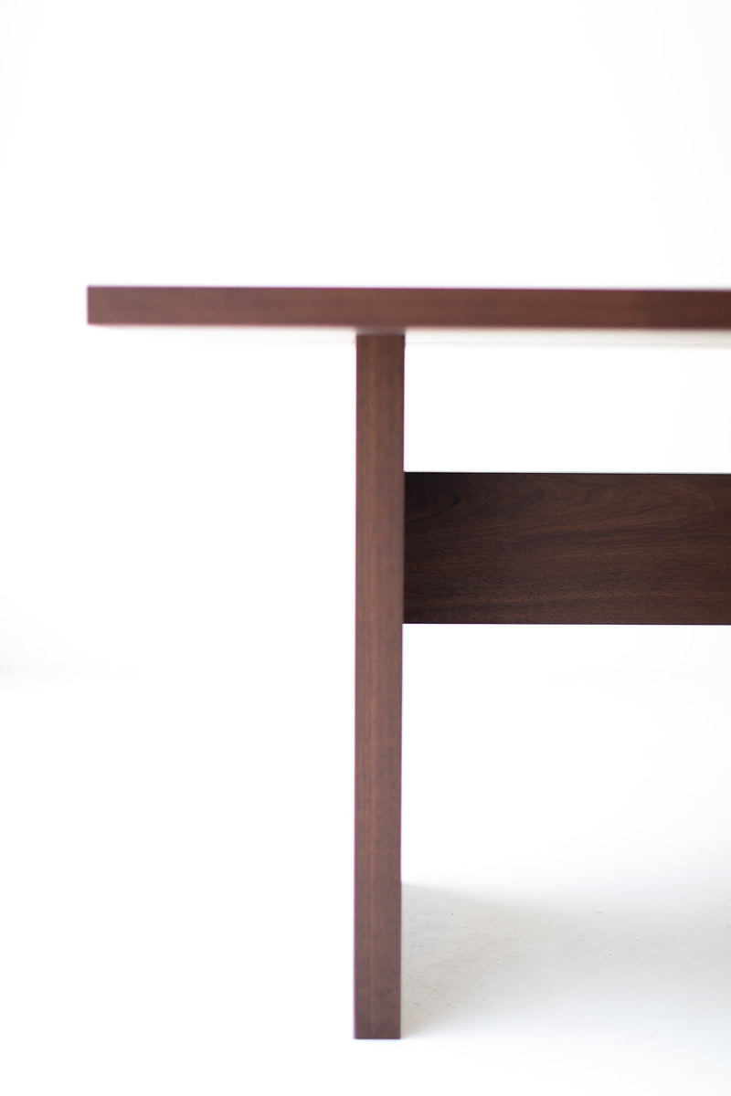 Toko Table shown with chairs around it