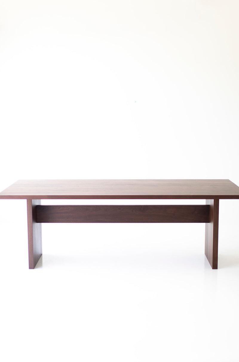 Angled detail view of the Toko modern walnut dining table