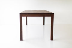 Modern luxury walnut dining table styled with place settings