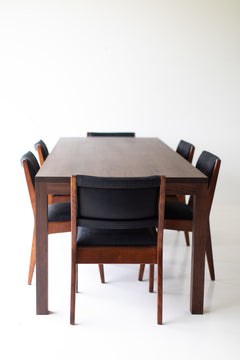 Modern luxury walnut dining table styled as a desk