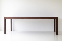 The Christopher modern luxury walnut dining table in a styled dining room