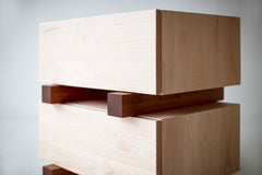 Front view of a Santa Fe maple nightstand showing its chunky drawer design